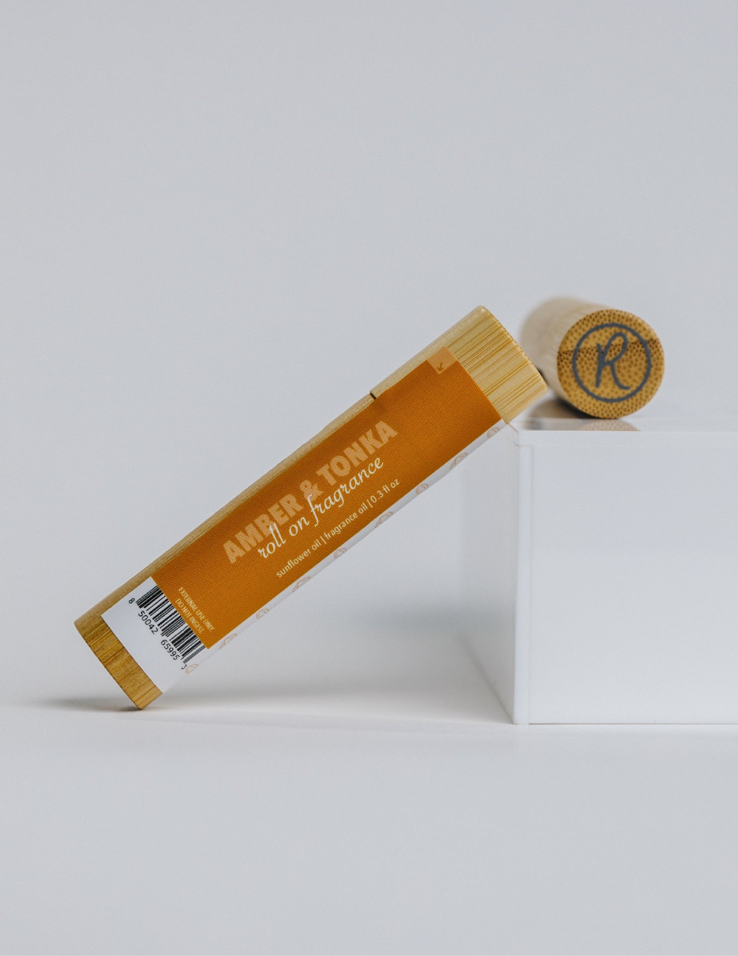 Amber & Tonka Roll On Fragrance Oil with lid